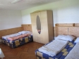 Chalupa_Dvoupok-apartmán_postele ve větším pokoji